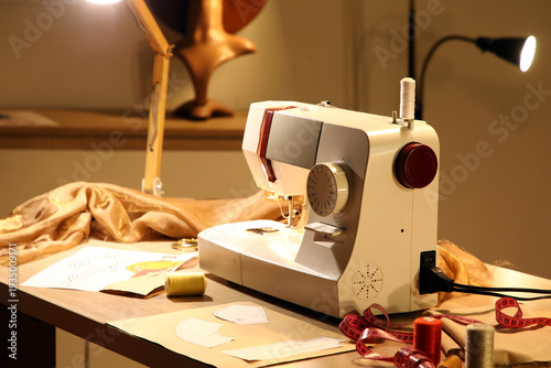 Tailor's workplace with sew...