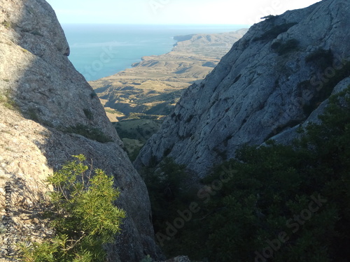 Beautiful mountain ridges and spring flowers in background Europe And sea and blue sky