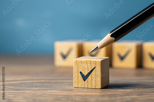 Pencil Marking Checkmark on Wooden Block