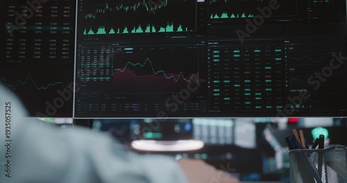 Close Up of Monitor Displaying Financial Charts in Digital Exchange Hub. Screen Display Fluctuating Stock Market Graphs and Analytical Data. Concept of Global Financial Monitoring and Big Data