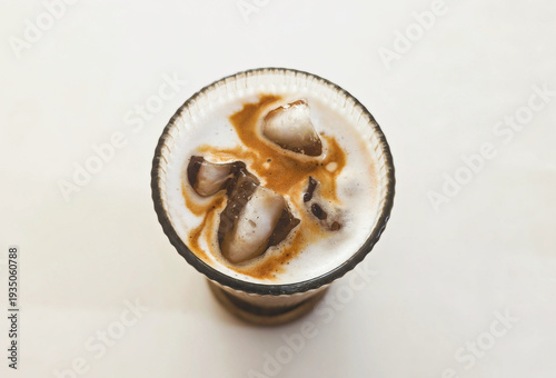 A glass of iced cappuccino coffee