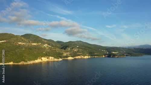 Wallpaper Mural Scenic view of the coastline and green hills of Syvota, Greece, under a clear blue sky with calm sea waters. Torontodigital.ca