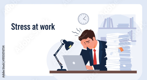 Stressed businessman in a suit sits at a desk with a laptop and a large pile of documents feeling overwhelmed by workload.