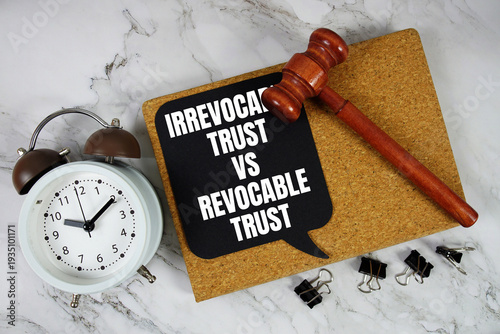Obraz na plátně Irrevocable Trust vs Revocable Trust text on speech bubble with alarm clock and