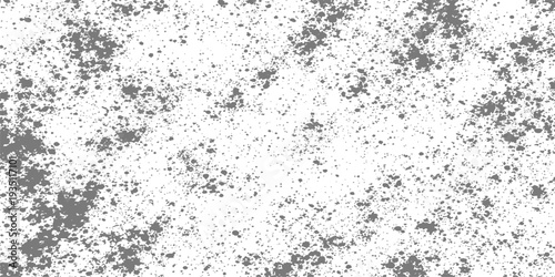 An abstract gray grunge background featuring a weathered concrete wall texture with a dirty stone pattern and paint splatters for an old industrial backdrop design