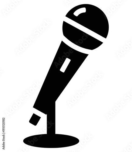 Simple black microphone icon on a stand against a white background representing public speaking and audio recording concepts in a minimalist design.