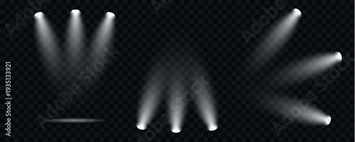 A collection of vibrant spotlights in various colors illuminates a transparent black background creating a dynamic effect