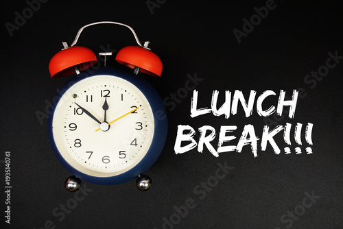 Lunch Break text with alarm clock on black background