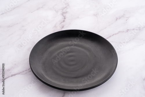 Black Rounded Ceramic Plate Marble Background