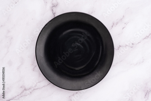 Black Rounded Ceramic Plate Marble Background
