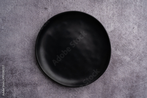Black Rounded Ceramic Plate Marble Background