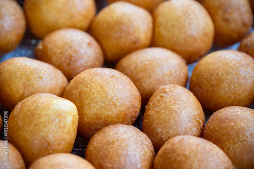 Close up of golden brown korean glutinous rice balls donuts at a market