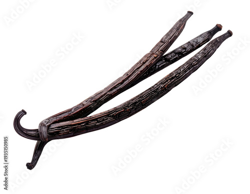 Three dried, dark brown vanilla bean pods arranged diagonally on a white background