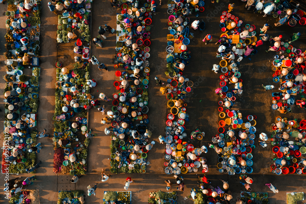 Fototapeta premium Aerial view of busy local daily life of the morning local market in Vi Thanh or Chom Hom market, Mekong Delta, Vietnam.