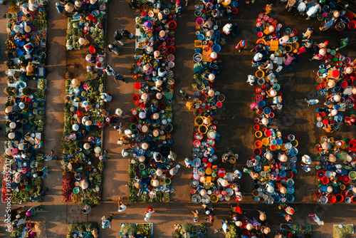 Aerial view of busy local daily life of the morning local market in Vi Thanh or Chom Hom market, Mekong Delta, Vietnam.