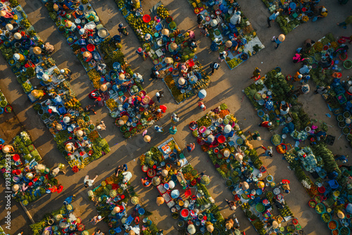 Aerial view of busy local daily life of the morning local market in Vi Thanh or Chom Hom market, Mekong Delta, Vietnam.