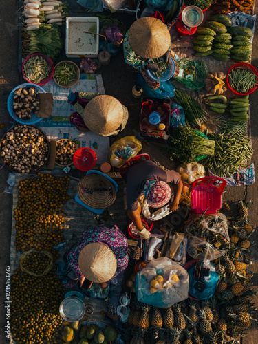 Aerial view of busy local daily life of the morning local market in Vi Thanh or Chom Hom market, Mekong Delta, Vietnam.
