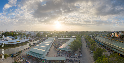 Aerial view of busy local daily life of the morning local market in Vi Thanh or Chom Hom market, Mekong Delta, Vietnam.