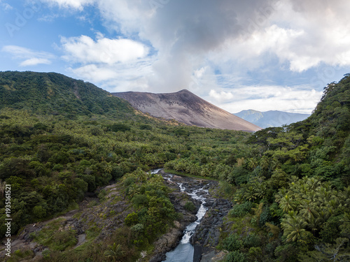 Aerial view of Mount Yasur, an active volcano surrounded by lush landscapes on Tanna island, Vanuatu