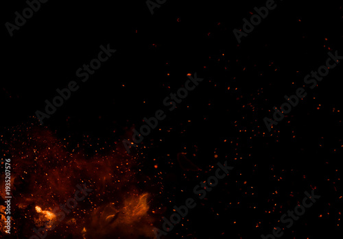 The black background shows fire in the foreground, surrounded by numerous sparks.