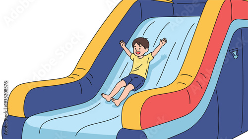 Happy young boy experiences the thrill of sliding down a large colorful inflatable water slide during a fun summer activity.