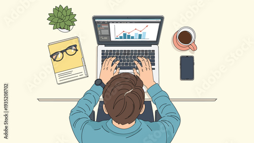 Top down view of a person typing on a laptop with a financial chart and graph on the screen next to coffee and notes.