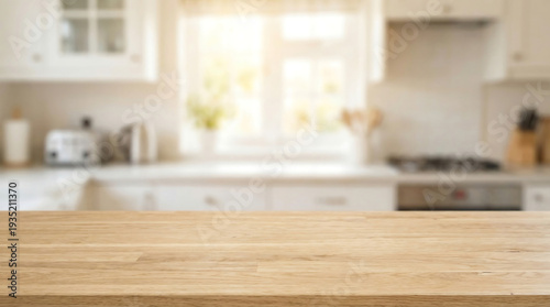 Empty light wood kitchen counter with blurred bright window background