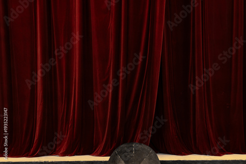 Vintage Prompter's Box on a Theater Stage in Front of Red Velvet Curtains