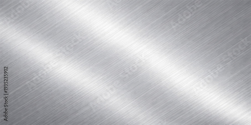 Abstract metallic texture with a brushed finish with a gradient of light reflecting a modern industrial aesthetic.