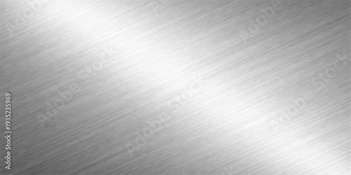 Abstract a stunning silver metal surface with a diagonal brushed texture catches the light, the image offers a minimalist, industrial look.