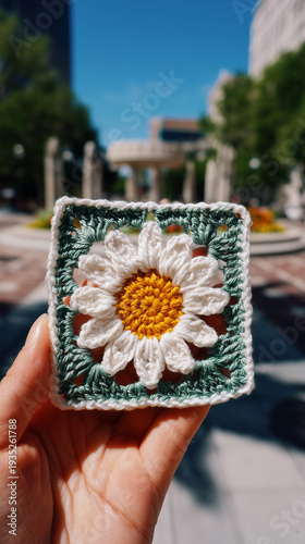 Crocheted Daisy Granny Square in Artist Hand