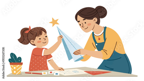 Woman and little girl creating paper crafts together at table