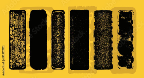A set of five black rectangular objects with varying textures, viewed from directly above, against a vibrant yellow surface.
