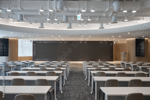 Quadro su tela Empty modern classroom or lecture hall interior with rows of seats and ceiling lighting