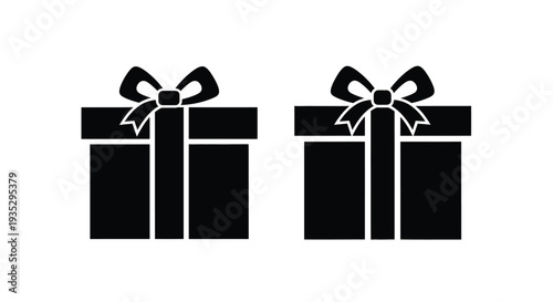 Two black gift boxes with bows isolated on a white background
