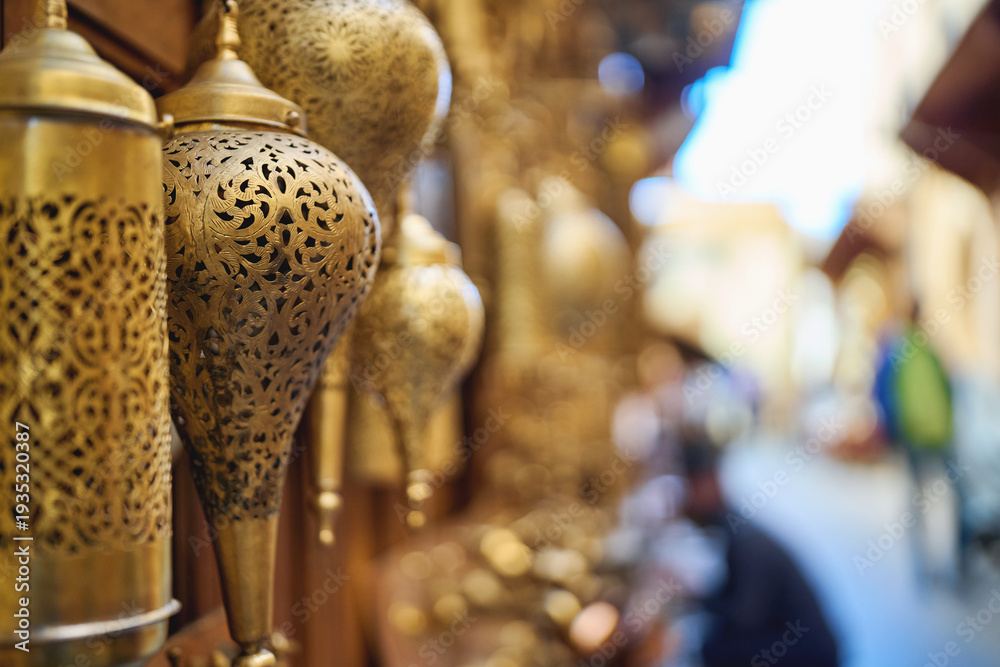 Obraz premium Ornate brass lanterns hanging in traditional market alley