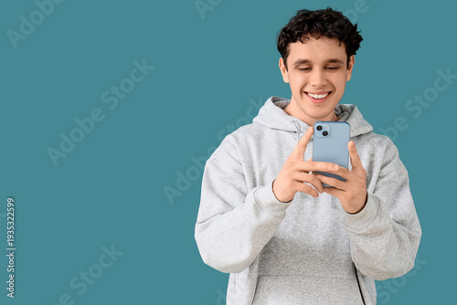 Young man in grey hoodie us...