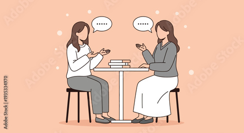 Two women sitting at a table engaged in a conversation.