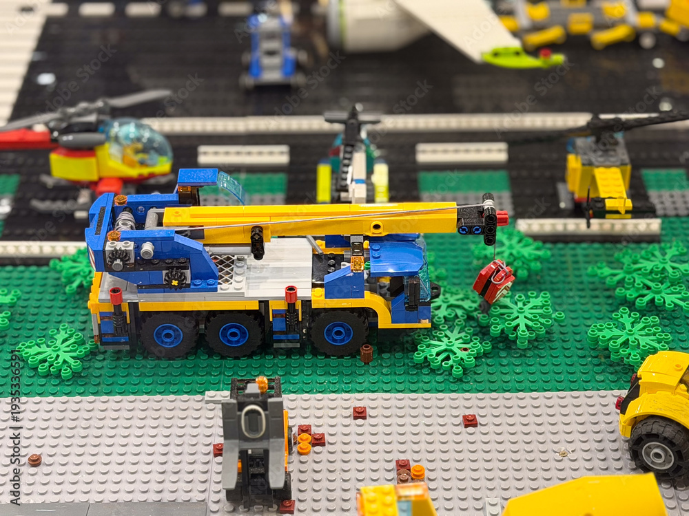 Fototapeta premium Lego crane truck lifting red object