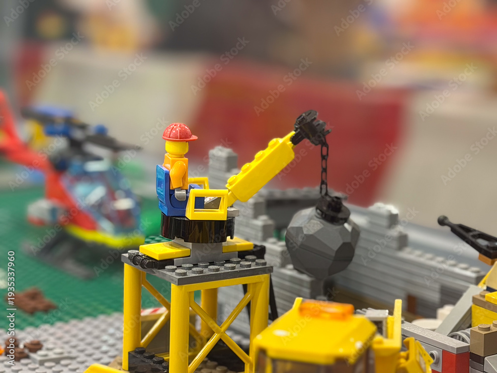 Fototapeta premium Lego construction minifigure operating crane
