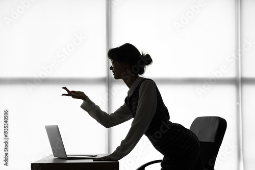 Silhouette of young busines...