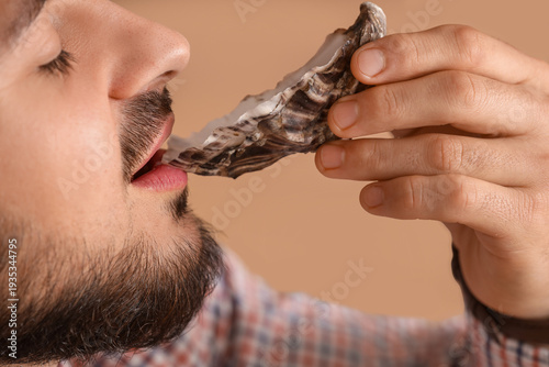 Handsome young man eating d...