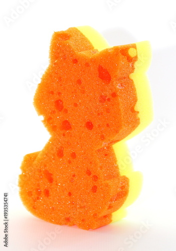 Orange on one side and yellow on the other side cat shaped washcloth for kids to use in the bath or shower.