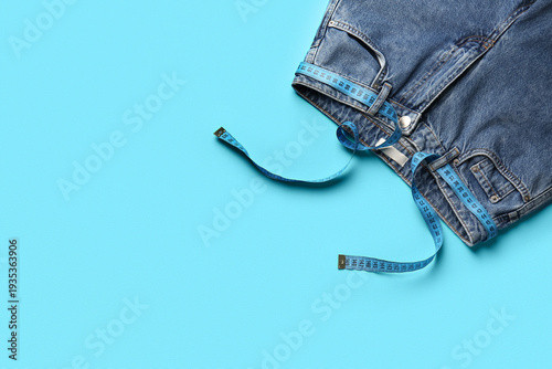 Jeans and measuring tape on...