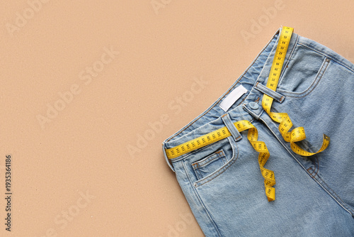 Jeans with measuring tape o...