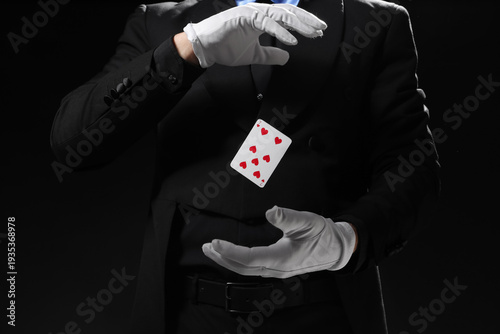 Male magician with levitati...