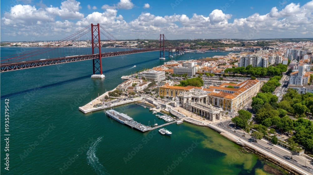 Obraz premium Elevated view captures a wide suspension structure spanning a large body of water near a coastal metropolitan area.
