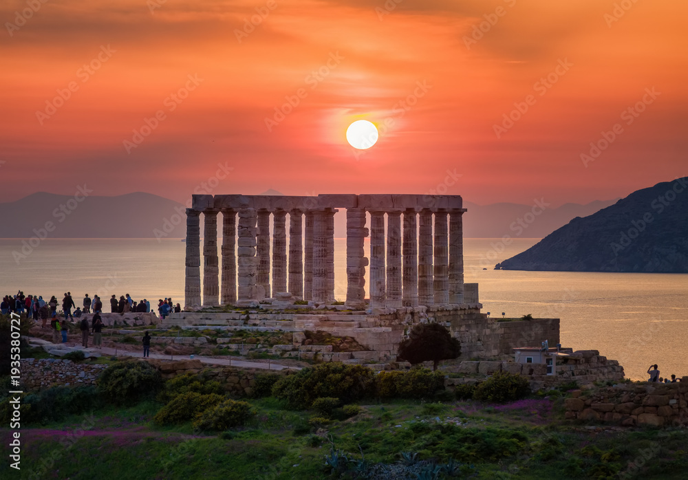 Fototapeta premium Close-up sunset view of the ancient Temple of Poseidon at Cape Sounion at the edge of Attica, close to Athens, Greece