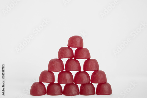 Canvas Print A pyramid of gummy vitamins on a light background