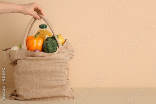 Female hand with vegetables...